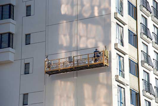 cladding being cleaned on mobile platform, London cladding cleaners